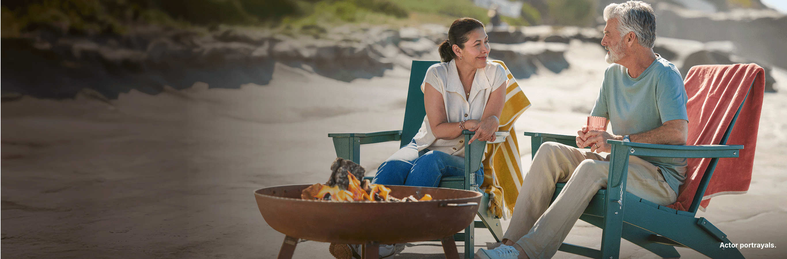 Two people sitting together. Actor portrayals.