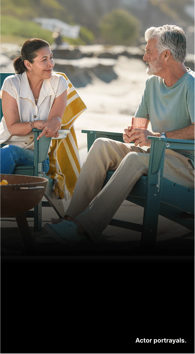 Two people sitting together. Actor portrayals.