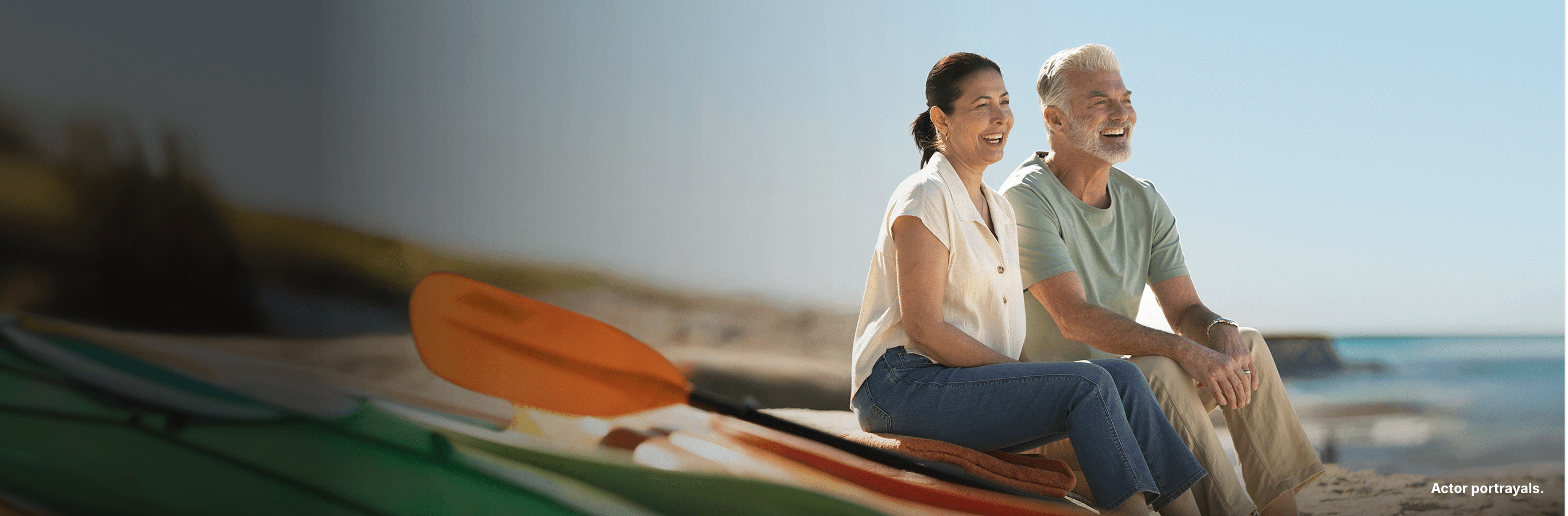 Two people next to a kayak. Actor portrayals.