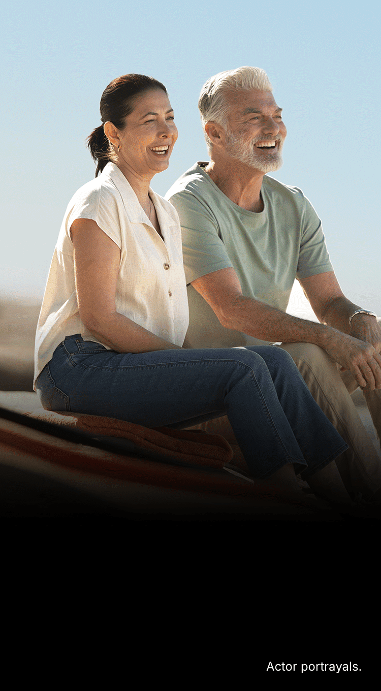 Two people next to a kayak. Actor portrayals.