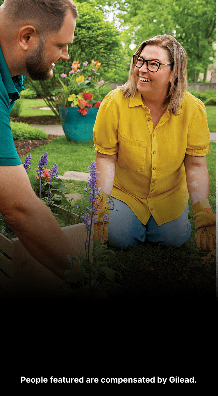 Jennifer, a woman with PBC, gardening in a yard with her husband