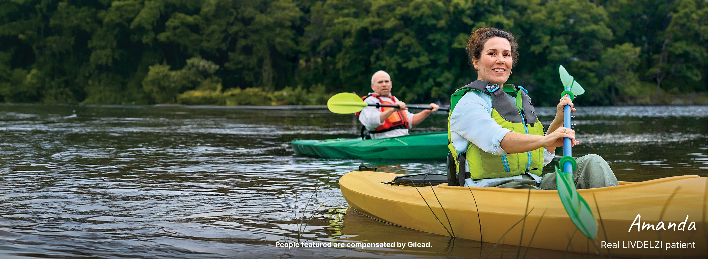 Two people sitting together. Actor portrayals.