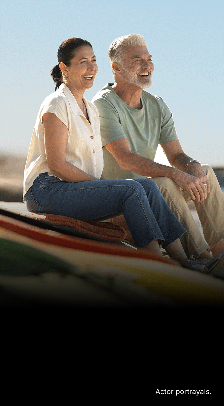Two people next to a kayak. Actor portrayals.