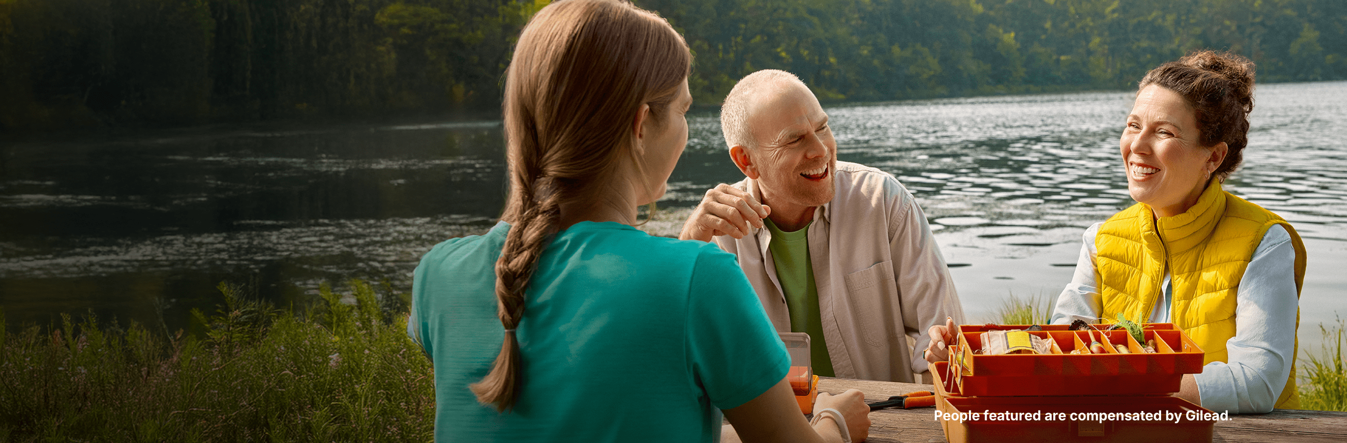 Amanda, a woman with PBC, sitting with her family by a pond