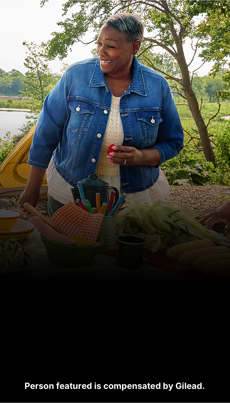 Angela, a woman with PBC, having a picnic with her family