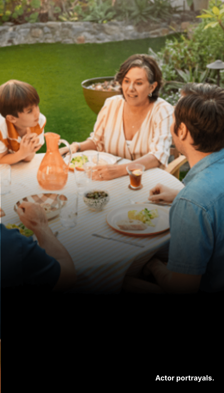 People sitting around a table. Actor portrayals.